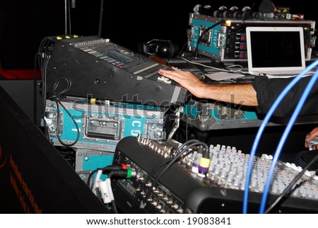 Audio and video mixing console operated by man