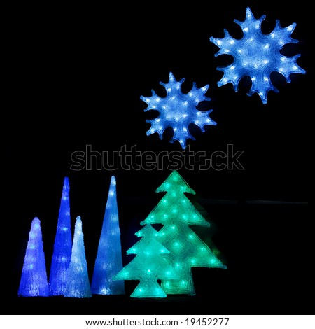 Colorful light glass christmas ice stars and christmas trees