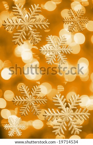 Ice stars and Christmas lights in yellow tone