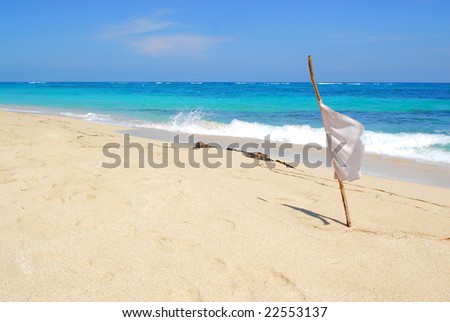 Safe to swim sign with white flag on Maguana beach on caribbean island Cuba