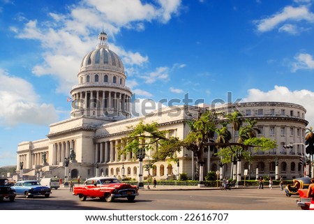 stock photo Capitolio building Havana Cuba with vintage old american cars