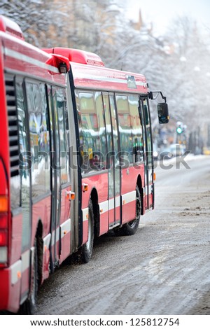 Bus on winter street, turning right