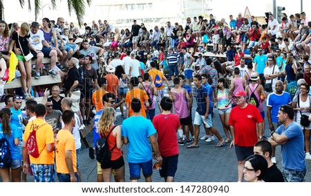 DENIA, SPAIN - JULY 7  People waiting for the bull run, in the streets of Denia on July 7, 2013.