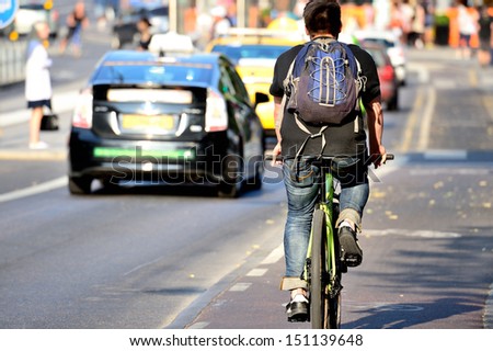 Person on bike in traffic