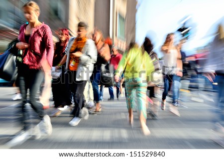Zoom And Motion Blurred Crowd Crossing Street. Blur Effects Made In Lens, Not Post Processing.