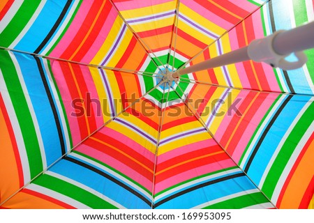 Parasol on beach seen from under