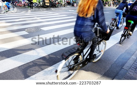Motion blurred bikes in traffic