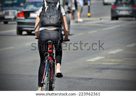 Person on bike in evening traffic