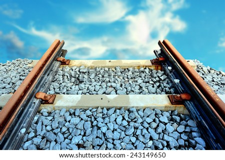 Railroad ending into cloudy sky. End of line