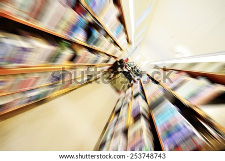 Library shelf, zoom blurred