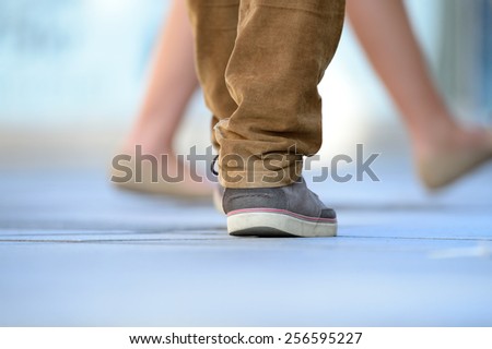 Close up of person walking on street