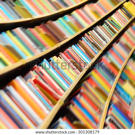 Round bookshelf, some shelves motion blurred