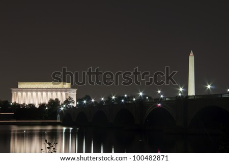 Abraham Lincoln Monument, Arlington Memorial Bridge and Washington Monument with reflection on Potomac River at sunset, Washington, DC, United States, at night