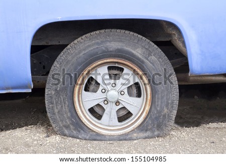 Close up Flat tire on the road waiting for repair