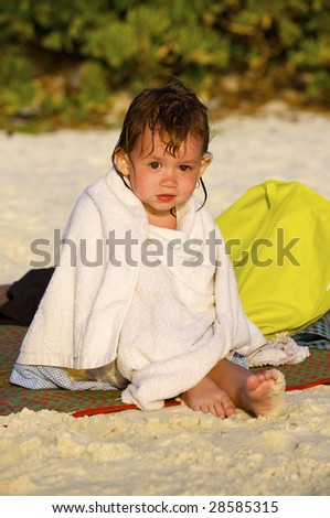 Girl plays on the sand