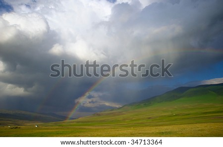 Rainbow after the storm in the mountains of Almaty region national park Assy