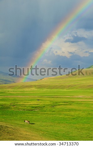 Rainbow after the storm in the mountains of Almaty region national park Assy