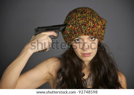 girl holding gun and killing her self. Isolated