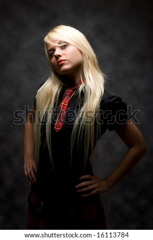 stock photo : Serious Girl Dressed in school uniform is giving Attitude
