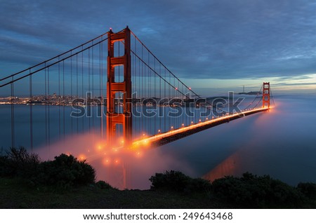Golden Gate Bridge at after sunset with fog