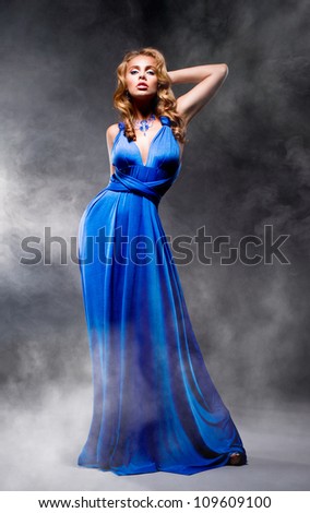 Beautiful girl in blue evening dress