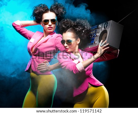 Dancing girls with a tape recorder