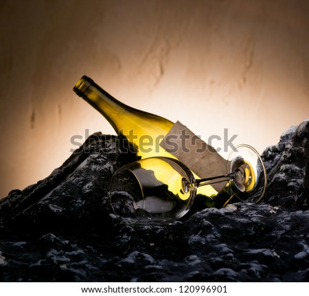 Composition with empty wine bottle