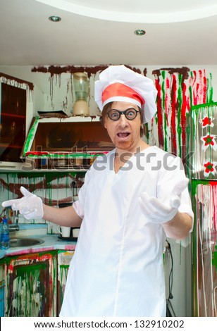 Cheerful cook in the painted kitchen