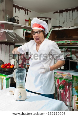 Frightened cook with lobster in the painted kitchen