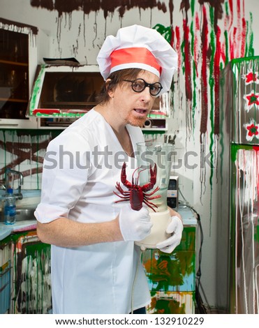 Crazy cook with lobster in the painted kitchen