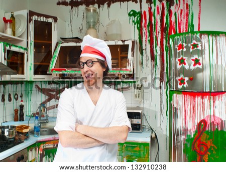 Cheerful cook in the painted kitchen