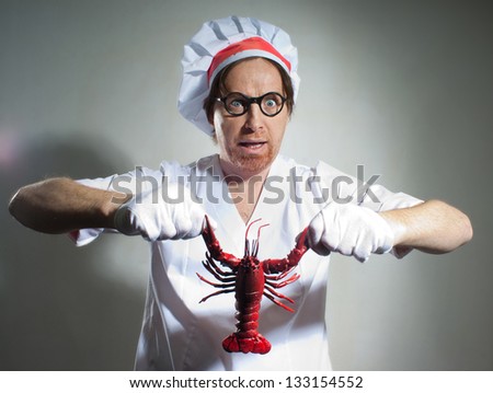 Funny chef with lobster on gray background