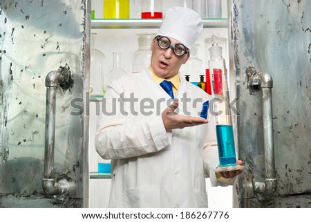 Chemist with a bottle in the lab