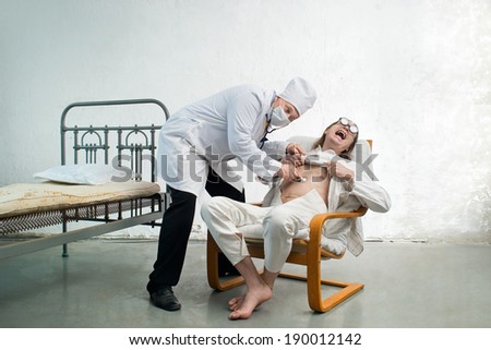 Doctor and bizarre patient in a hospital
