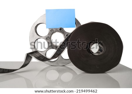 Reel of film with paper for writing