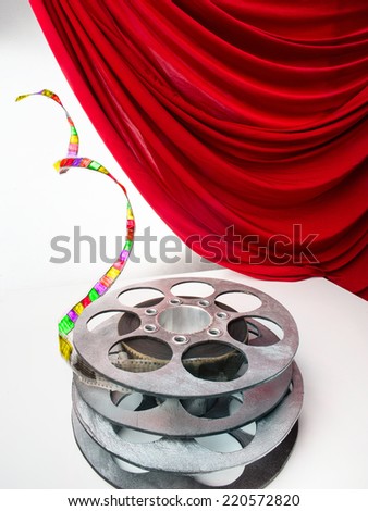 Reel of film and red curtain