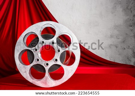 Reel of film and red curtain