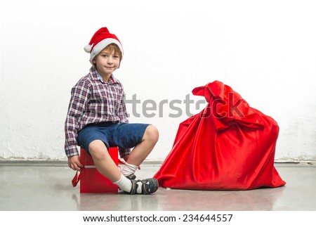 Little Santa Claus with red sack