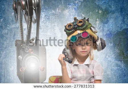 Little girl with a film projector