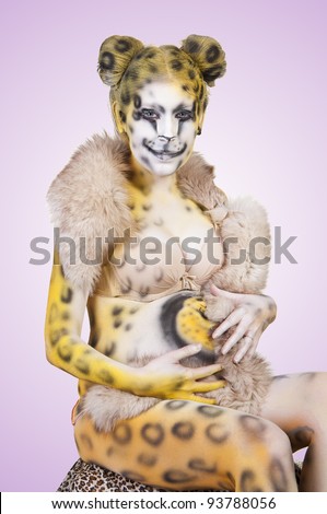 Beautiful Pregnant Woman With Body Painting On Her Body Isolated On A Colored Background