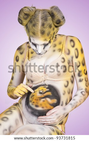 Beautiful Pregnant Woman With Body Painting On Her Body Isolated On White
