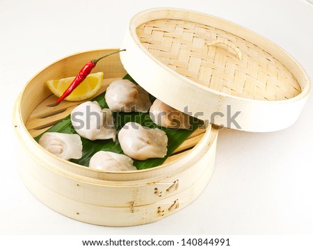 Dimsum Hagao in chinese bamboo basket. dumplings. isolated on white