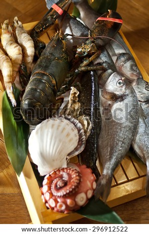Fresh catch of fish and other seafood on wooden board
