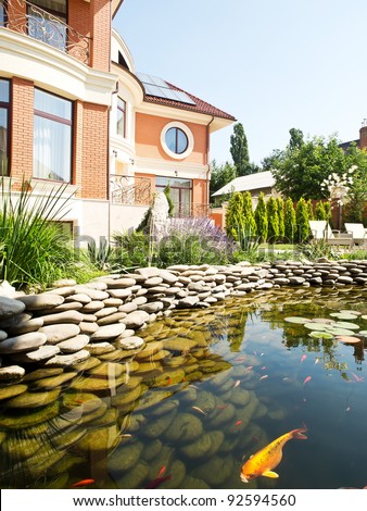house with pond with fish