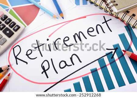 The words Retirement Plan written on a bar graph surrounded by pencils, books and calculator.