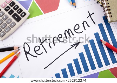The word Retirement written on a bar graph surrounded by pencils, books and calculator.