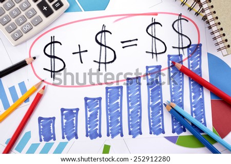 Simple savings or retirement formula written on a hand drawn bar chart surrounded by calculator, books and pencils.