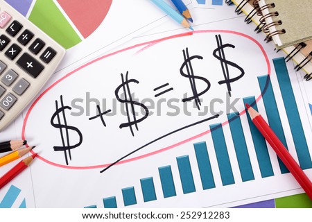 Savings plan : Simple savings or retirement plan on bar graph surrounded by calculator, books and pencils.  Saving, planning, growth concept.