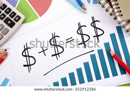 Savings plan : Simple savings or retirement plan on bar graph surrounded by calculator, books and pencils.  Saving, retirement, planning concept.