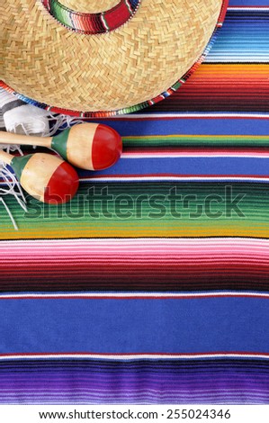 Mexican background, sombrero, serape blanket, maracas.